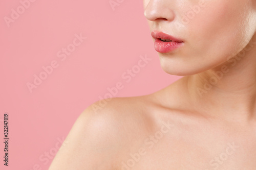 Close up cropped blonde half naked woman 20s perfect skin lips nude make up isolated on pastel pink wall background studio portrait. Skin care healthcare cosmetic procedures concept Mock up copy space