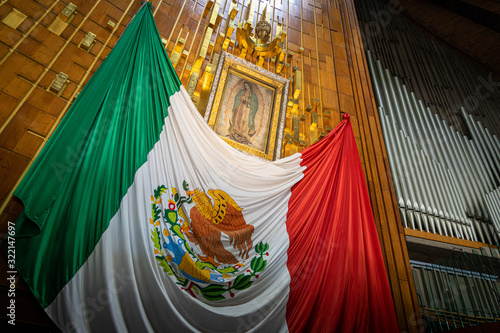 Our Lady of Guadalupe with mexican flag in Mexico City