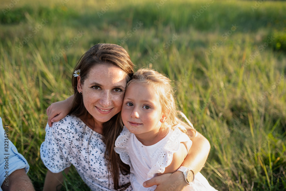 Mother with small toddler daughter on walk on meadow outdoors. Mother with small toddler daughter on walk on meadow outdoors.
