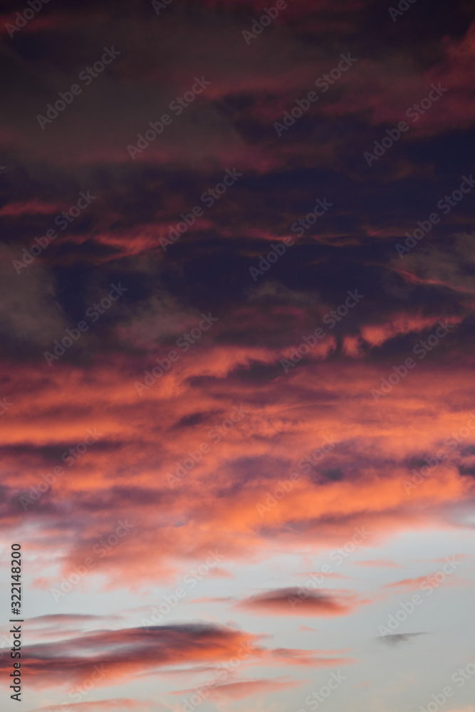 Obraz premium beautiful dramatic sky with dark and bright clouds at sunset, summer landscape, golden sunlight