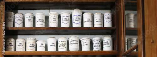 Wooden shelf with medicines in an old pharmacy.