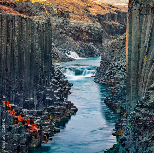 Spectacular summer view of Studlagil Canyon, the walls of which formed from basalt columns. Superb morning landscape of Jokulsa A Bru river. Dramatic outdoor scene of Iceland, Europe.