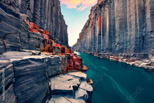 Awesome summer view of Studlagil Canyon. Breathtaking morning landscape of Jokulsa A Bru river. Superb outdoor scene of Iceland, Europe. Beauty of nature concept background.