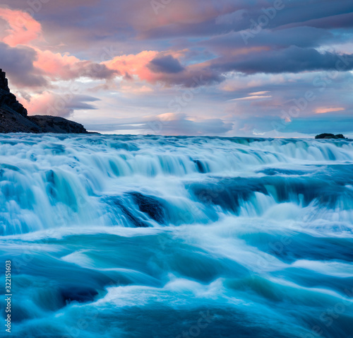 Stunning summer sunrise on of Gullfoss - popular tourist destination. Amazing morning view of Hvita river. Great outdoor scene of Iceland, Europe. Traveling concept background.