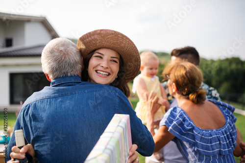 Portrait of happy people outdoors on family birthday party. © Halfpoint