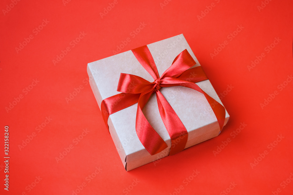 Obraz premium gift on red background with copy space. celebration concept