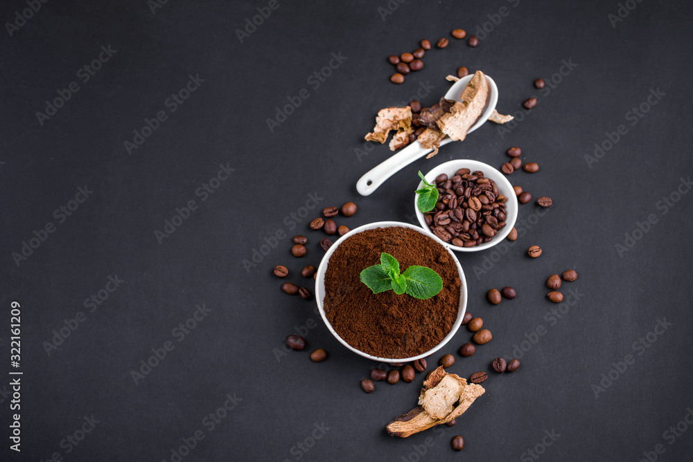 Mushroom Chaga Coffee Superfood Trend-dry and fresh mushrooms and coffee beans on dark background with mint. Coffee break Mushroom Chaga Coffee Superfood Trend-dry and fresh mushrooms and coffee beans on dark background with mint. Coffee break