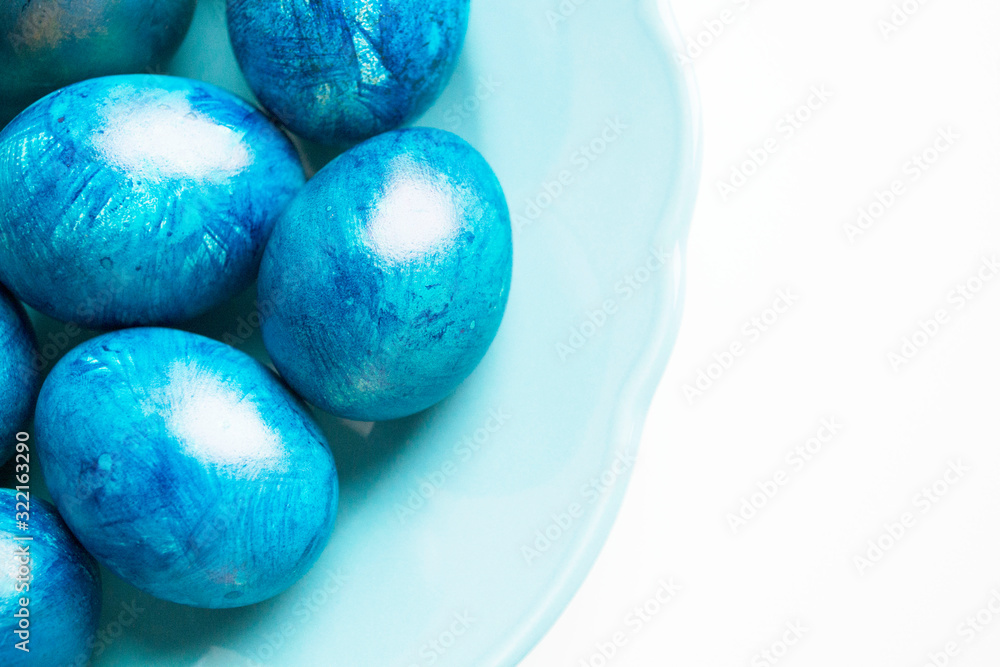 blue eggs laid on a blue plate on the table for Easter blue eggs laid on a blue plate on the table for Easter