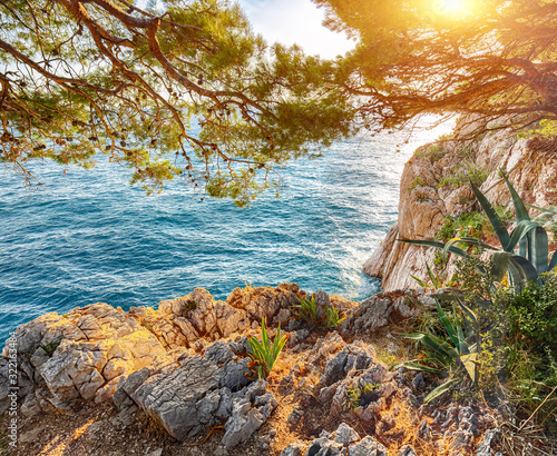 Beautiful sunset above Adriatic sea and coastline in Makarska.