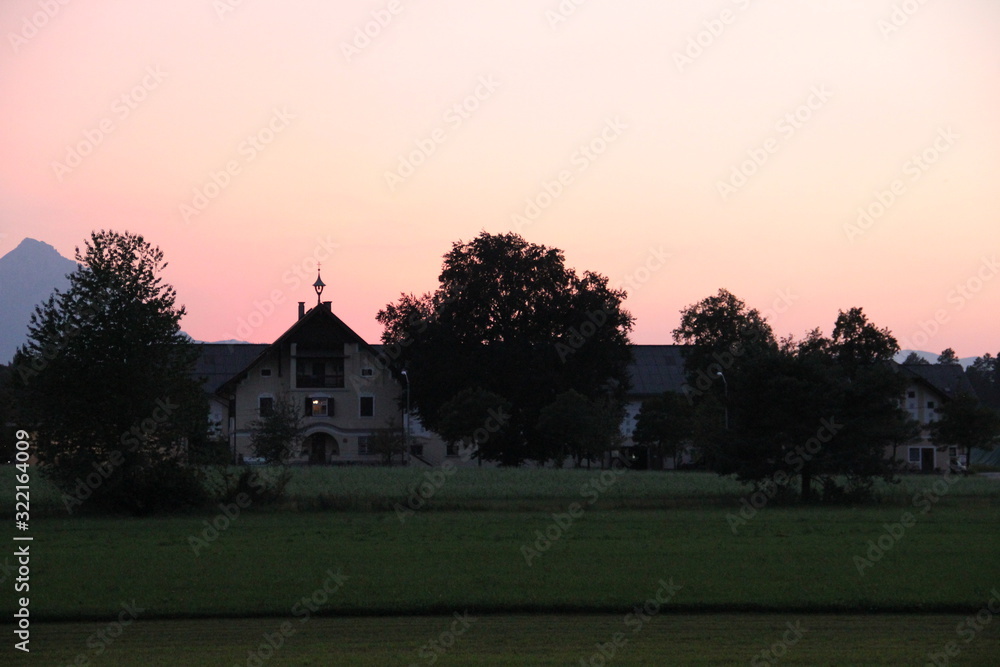 country house with pink sky