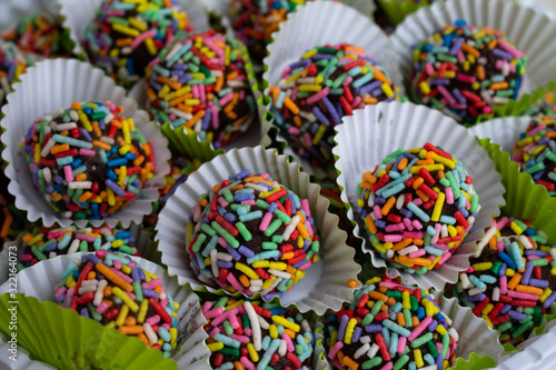 Truffles with colorful colors. Selective focus.Sweet food for birthdays. Truffles in his cap