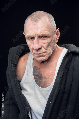 Vászonkép Portrait of a prisoner criminal on a black background