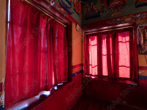 Red curtains in Thiksay Monastery outside of Leh, Ladakh, India.