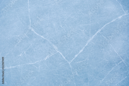 texture of ice on the rink with skating traces 