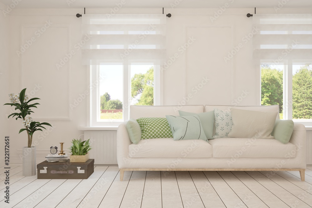 Fototapeta premium Stylish room in white color with sofa and summer landscape in window. Scandinavian interior design. 3D illustration