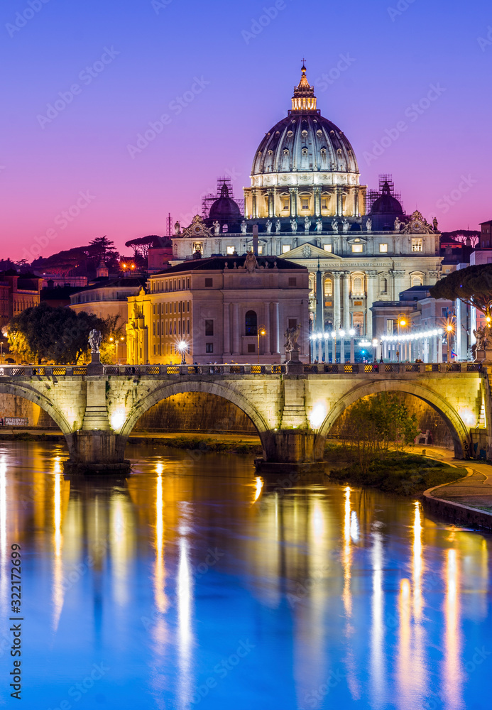 St Peter's Cathedral and Vatican city seen at dusk, over the river Tiber. Rome, Lazio, Italy.