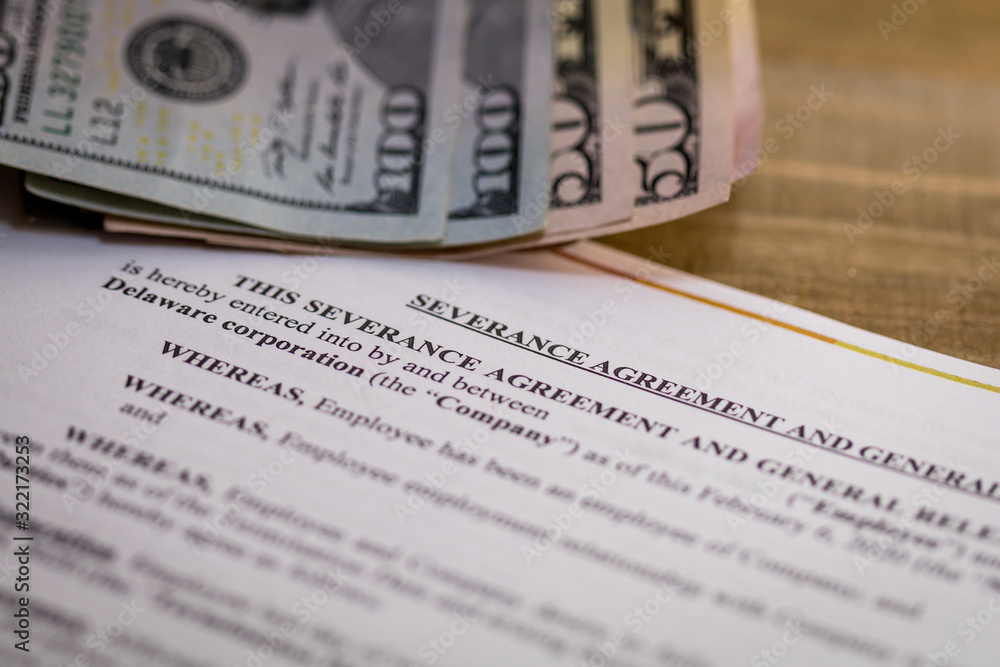 Severance Pay concept with agreement document on wooden board Severance Pay concept with agreement document on wooden board