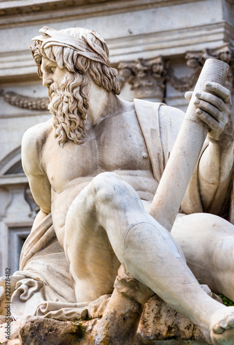 Statue of river God Ganges Navona square Rome Italy photo