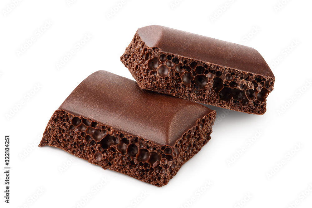 Small dark chocolate pieces isolated on white background with clipping path Small dark chocolate pieces isolated on white background with clipping path