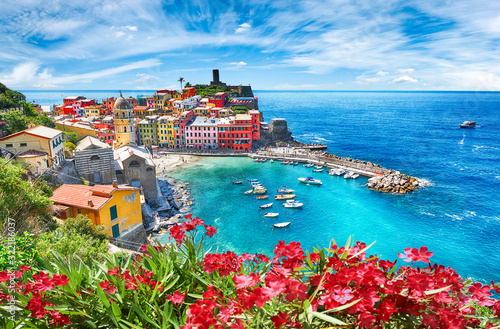 Famous city of Vernazza in Italy during summer photo
