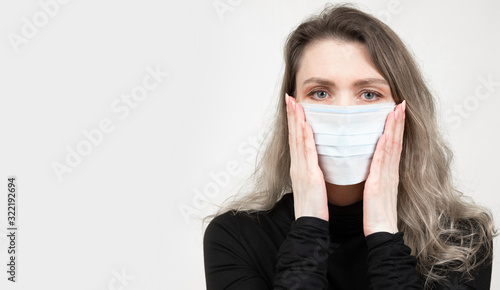 Woman in a medical mask. A ...