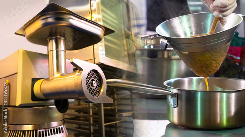 Industrial meat grinder in ...