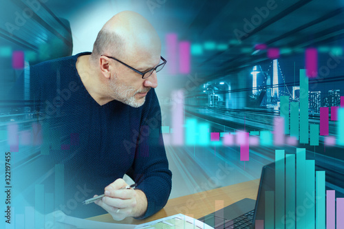 A man at a computer against the background of stock quotes and the evening city. Investments in exchange-traded assets. Stock market game. Work on the stock market. Securities market.