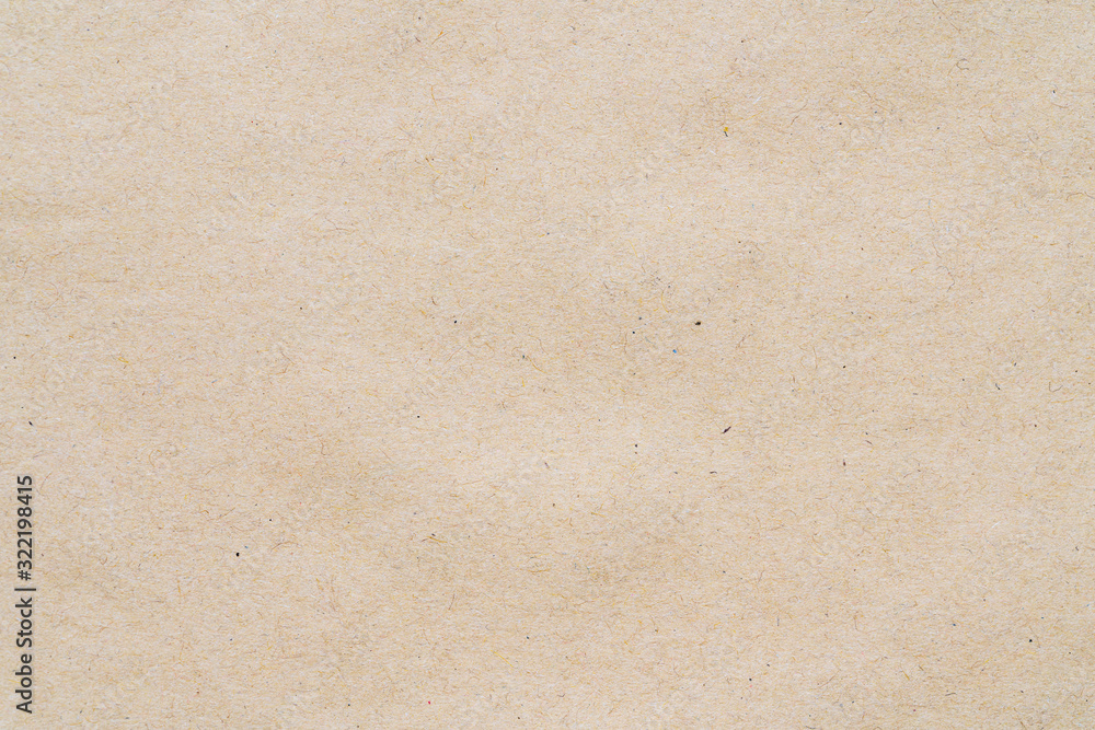Light yellow pattern from sheet of recycled carton. Close-up detail photomicrography view of abstract texture recycled eco-friendly cardboard material background. Light yellow pattern from sheet of recycled carton. Close-up detail photomicrography view of abstract texture recycled eco-friendly cardboard material background.