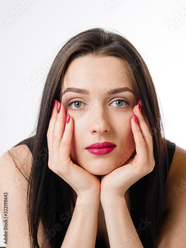 Business young beautiful lady on a white background shows different emotions copy space