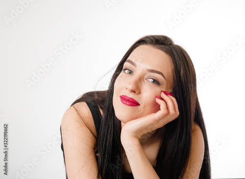 Business young beautiful lady on a white background shows different emotions copy space