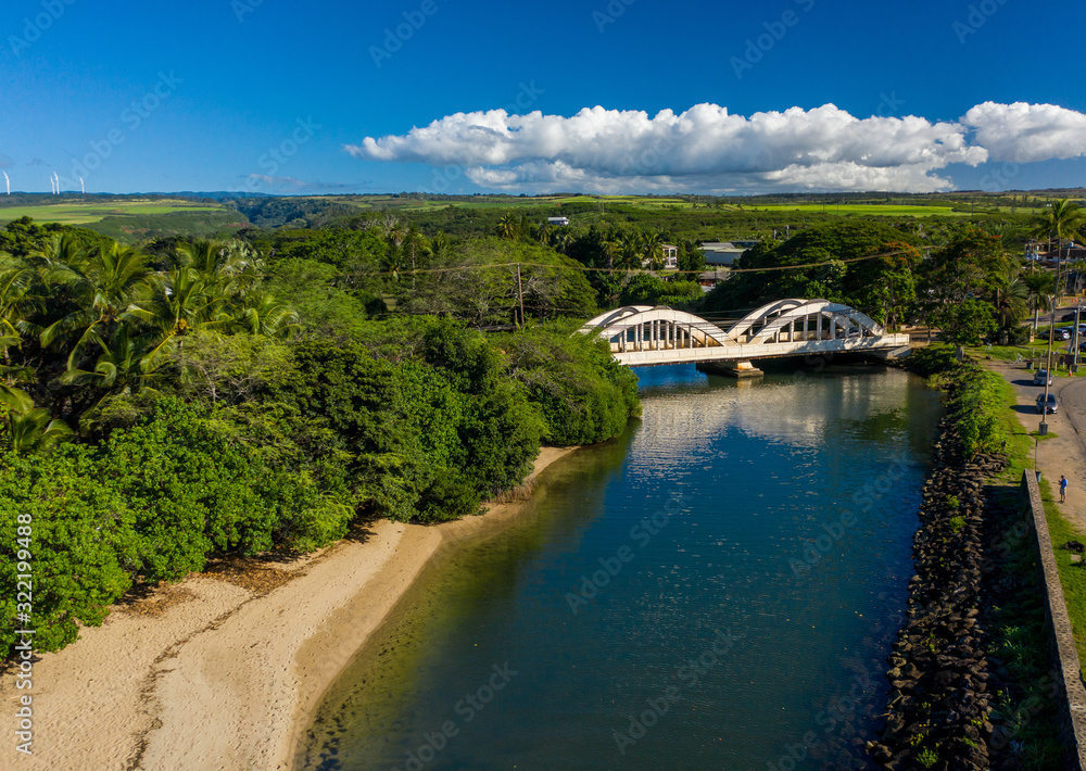 Aerial shot of the river anahulu and the twin arched road bridge in the North Shore town of Haleiwa