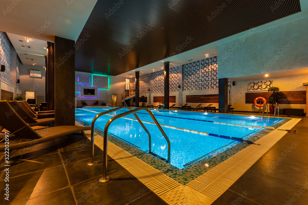 Modern blue on light backdrop. Water - swimming pool. Blue luxurious swimming pool. Swimming pool for luxury lifestyle design. Water - swimming pool. Luxury lifestyle. Natural pattern, luxury. Blue Modern blue on light backdrop. Water - swimming pool. Blue luxurious swimming pool. Swimming pool for luxury lifestyle design. Water - swimming pool. Luxury lifestyle. Natural pattern, luxury. Blue