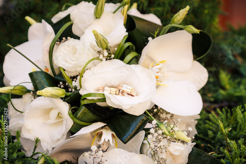Wedding rings on the wedding bouquet