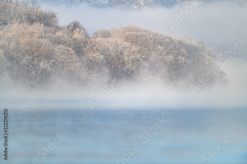 frozen and foggy landscape of Kussharo lake