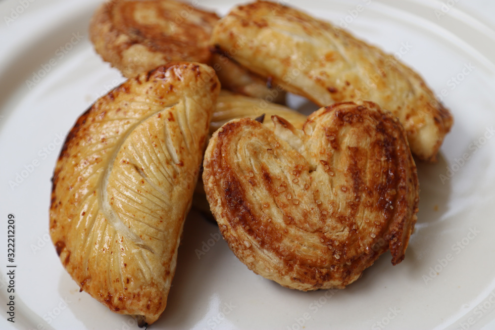 various puff pastries with palmiers and apple turnovers