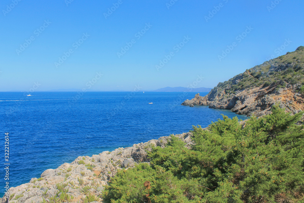 View of Tirrenic sea with rocks and vegetation. Monte Argentario, Tuscany, Italy