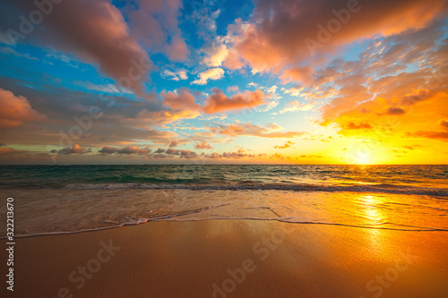 Beach sunrise over the tropical sea © ValentinValkov