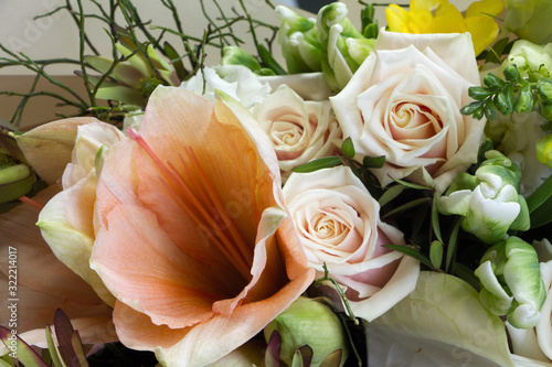 Detail closeup of beautiful summer bouquet in pink colors, gray backdrop, selective focus photo