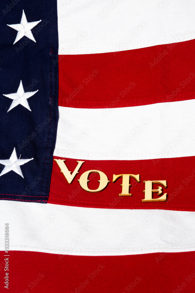 Close up of the USA flag with the letters vote angled, vertical Close up of the USA flag with the letters vote angled, vertical