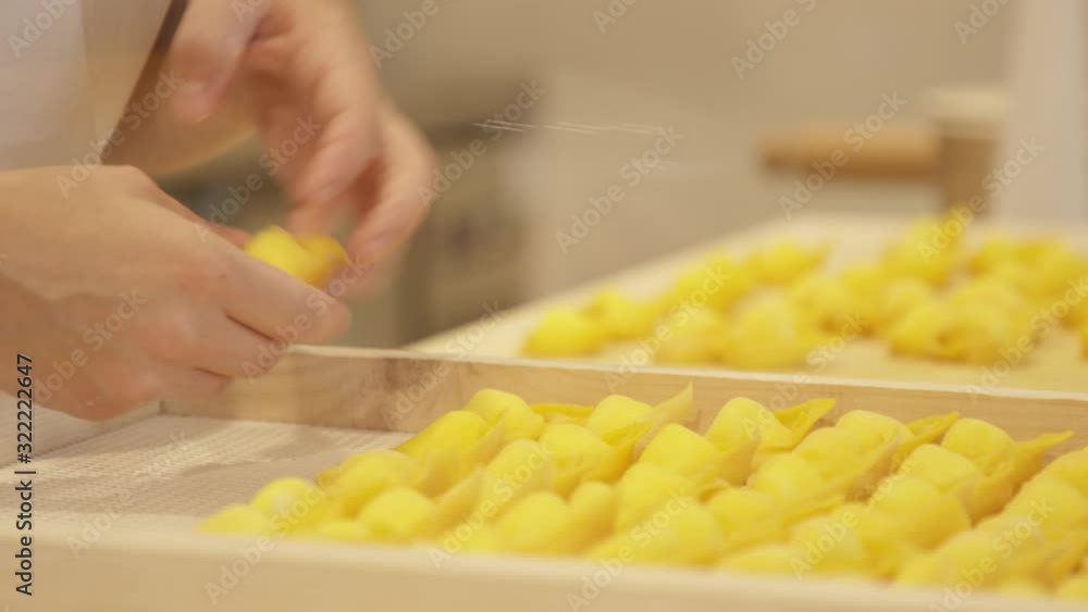 Italian Chef Preps fresh Pasta on Trays Italian Chef Preps fresh Pasta on Trays