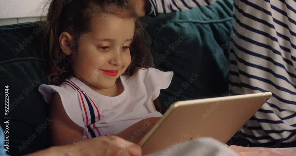 CU Tilt & Swing Grandparents Using Tablet with Granddaughter. Shot in R3D (6K RED RAW) CU Tilt & Swing Grandparents Using Tablet with Granddaughter. Shot in R3D (6K RED RAW)