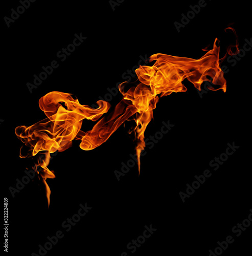 Fire flames on a black background. © photodeedooo