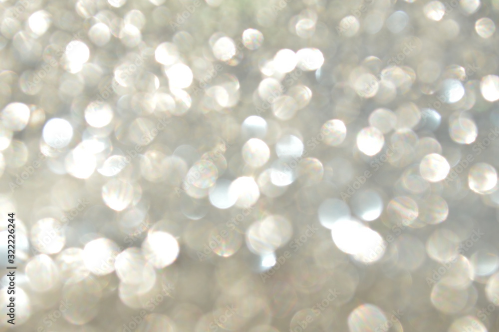 Bokeh of bright glittering sheet with shining sunlight Bokeh of bright glittering sheet with shining sunlight