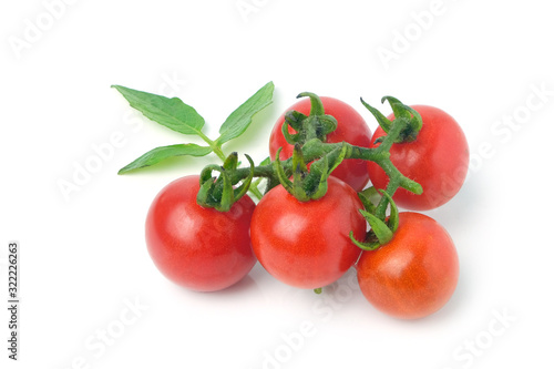 Bunch of cherry tomatoes and leaf tomatoes isolated on white background.