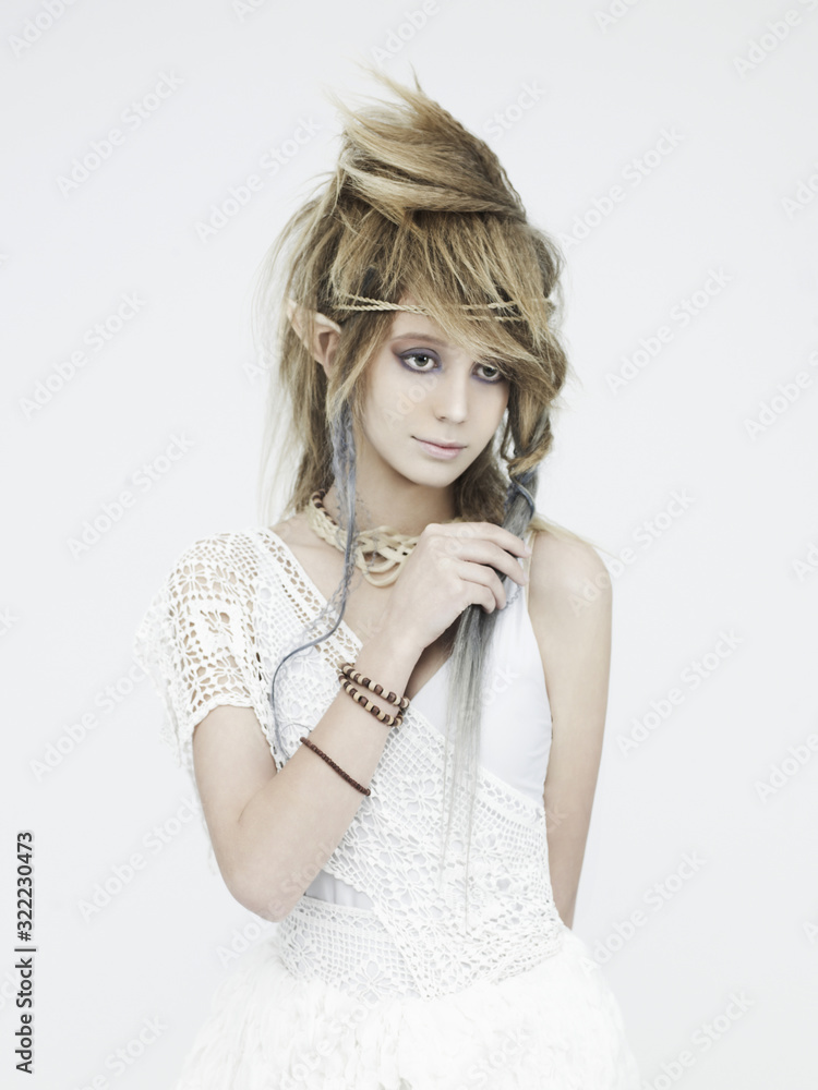 Stylish picture of a beautiful young girl elf with stylish hairstyle and makeup. Stylish picture of a beautiful young girl elf with stylish hairstyle and makeup.