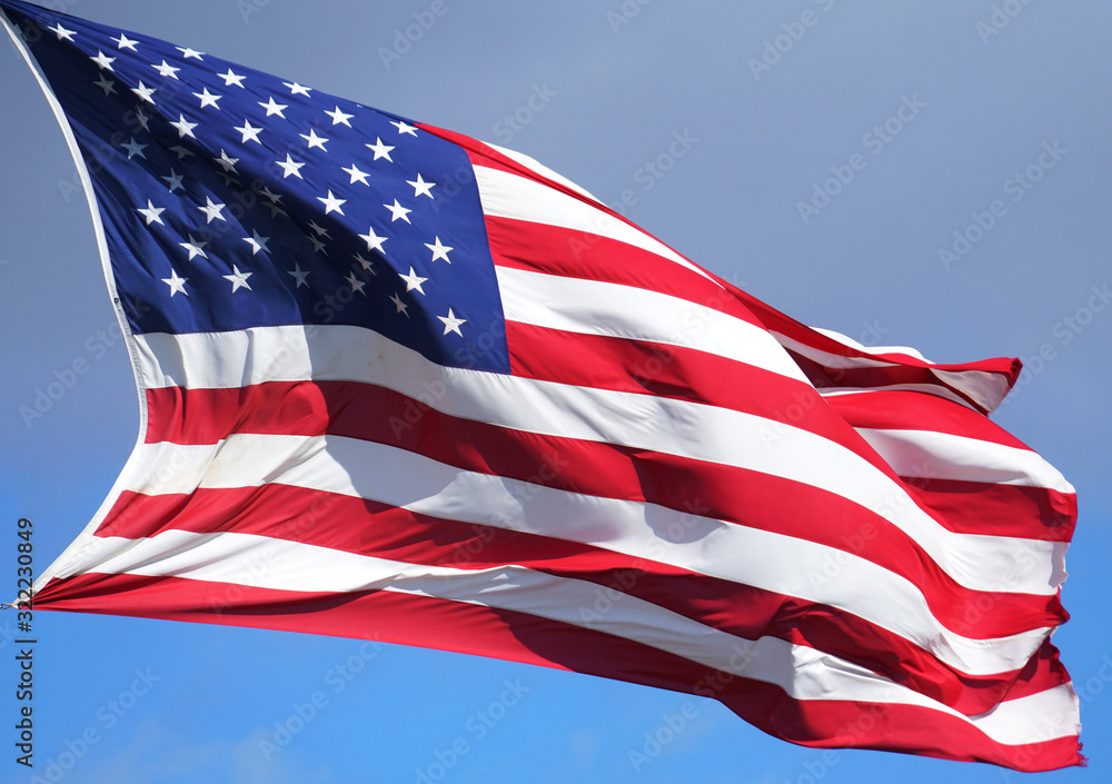 Fototapeta premium close up on USA flag waving in the wind