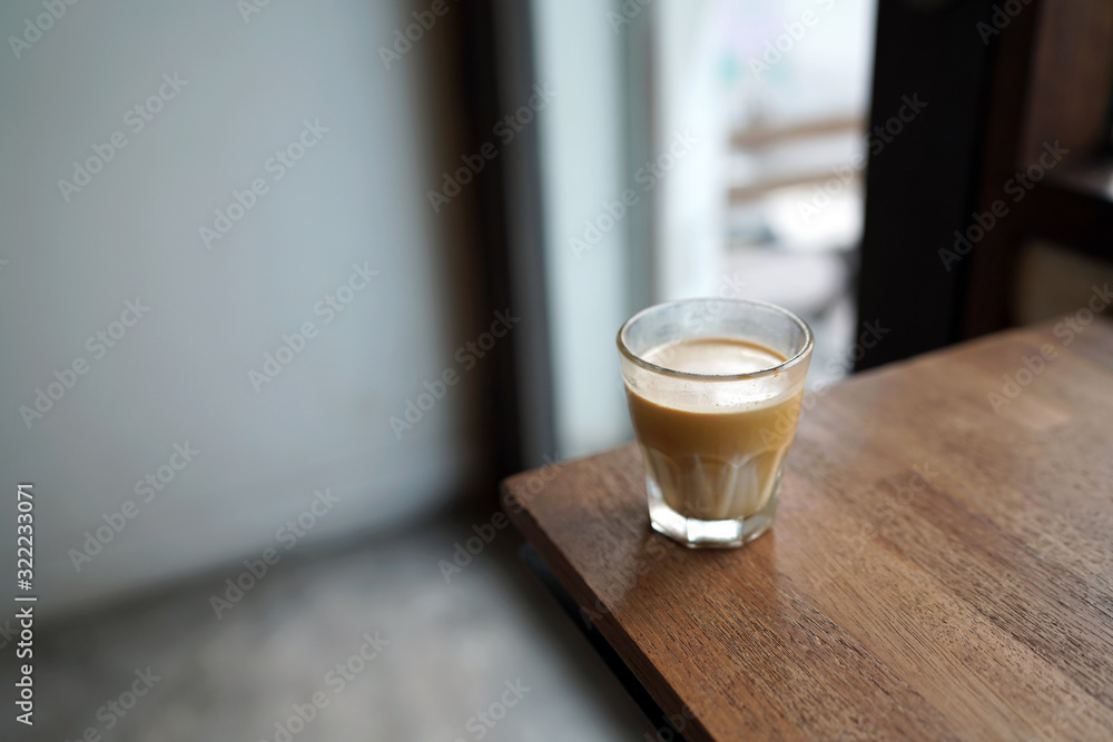 Dirty Coffee - A glass of espresso shot mixed with cold fresh milk on blurred background and copy space, Perfect drink for summer time. Dirty Coffee - A glass of espresso shot mixed with cold fresh milk on blurred background and copy space, Perfect drink for summer time.