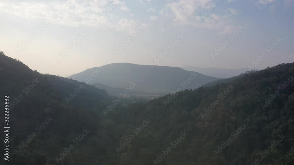 Aerial view of mountain against foggy sky Aerial view of mountain against foggy sky
