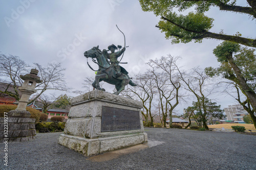 Yabusame Statue, sculpture in Fujisan Hongu Sengen Taisha shrine temple, Fujinomiya, Shizuoka city, Japan. Tourist attraction. Architecture landscape background. photo