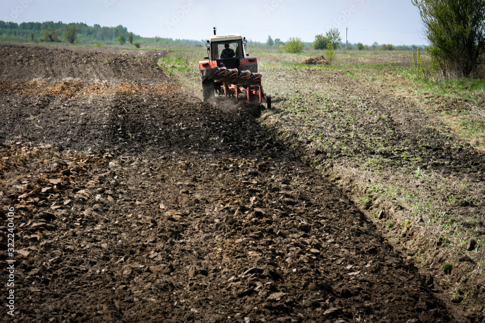 Tractor on the agricultural field Tractor on the agricultural field